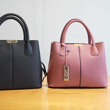 Chic Handbag with Metal Charm